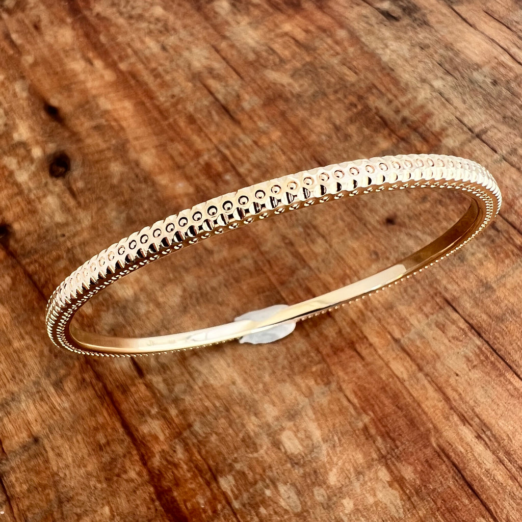 Solid 14k Gold Bangle with hand-engraving.