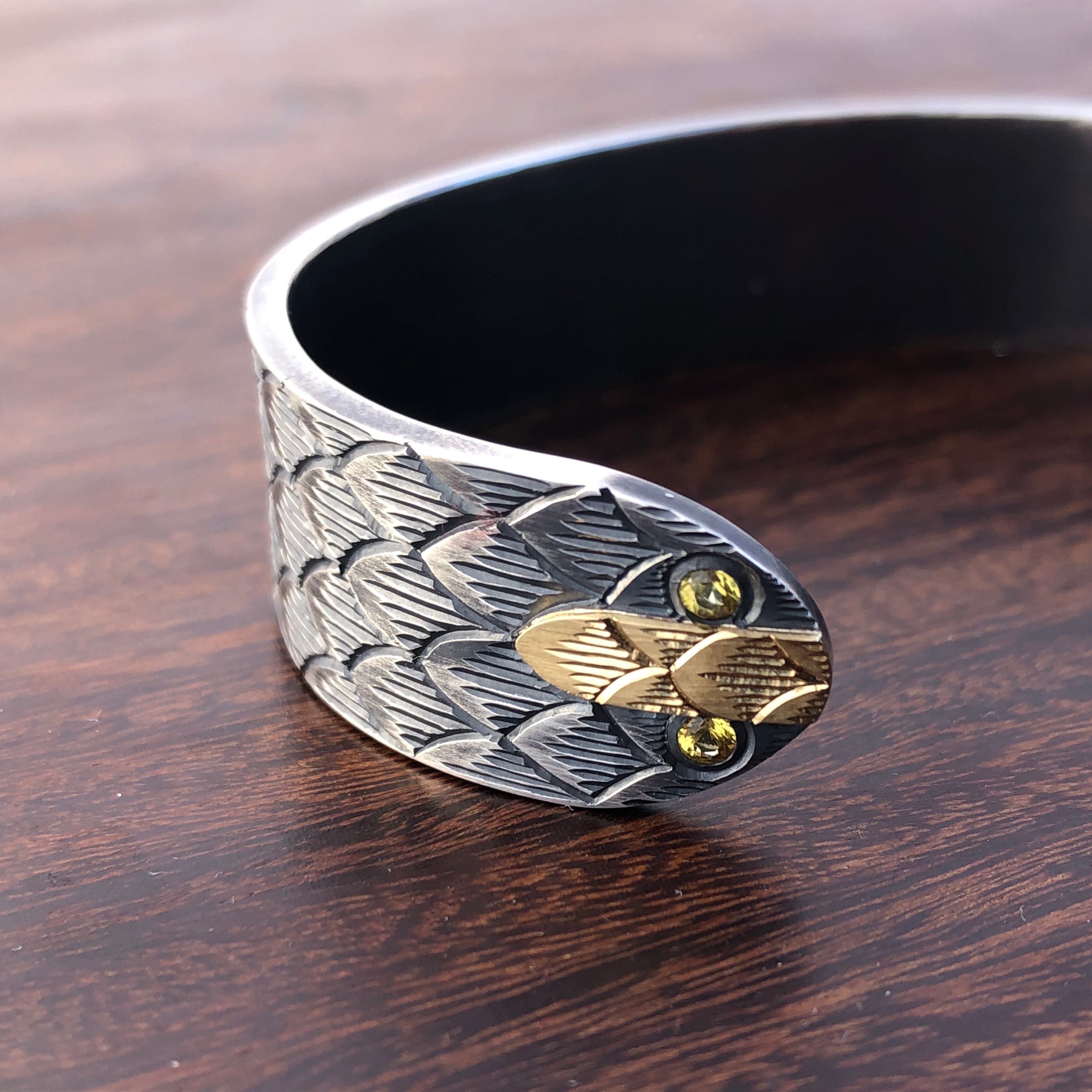 Snake cuff with yellow sapphires