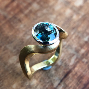 Blue-Green Sapphire in platinum and 18k yellow gold