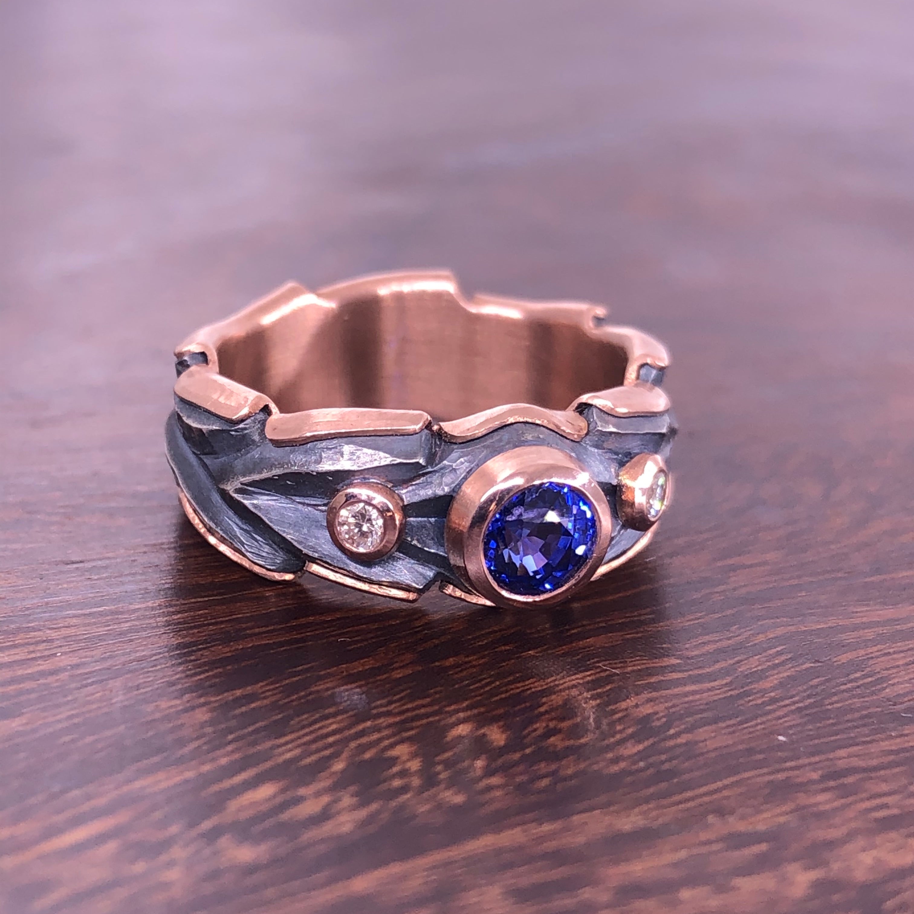 Blue Sapphire (.81ct) in rose gold and sterling oak ring.